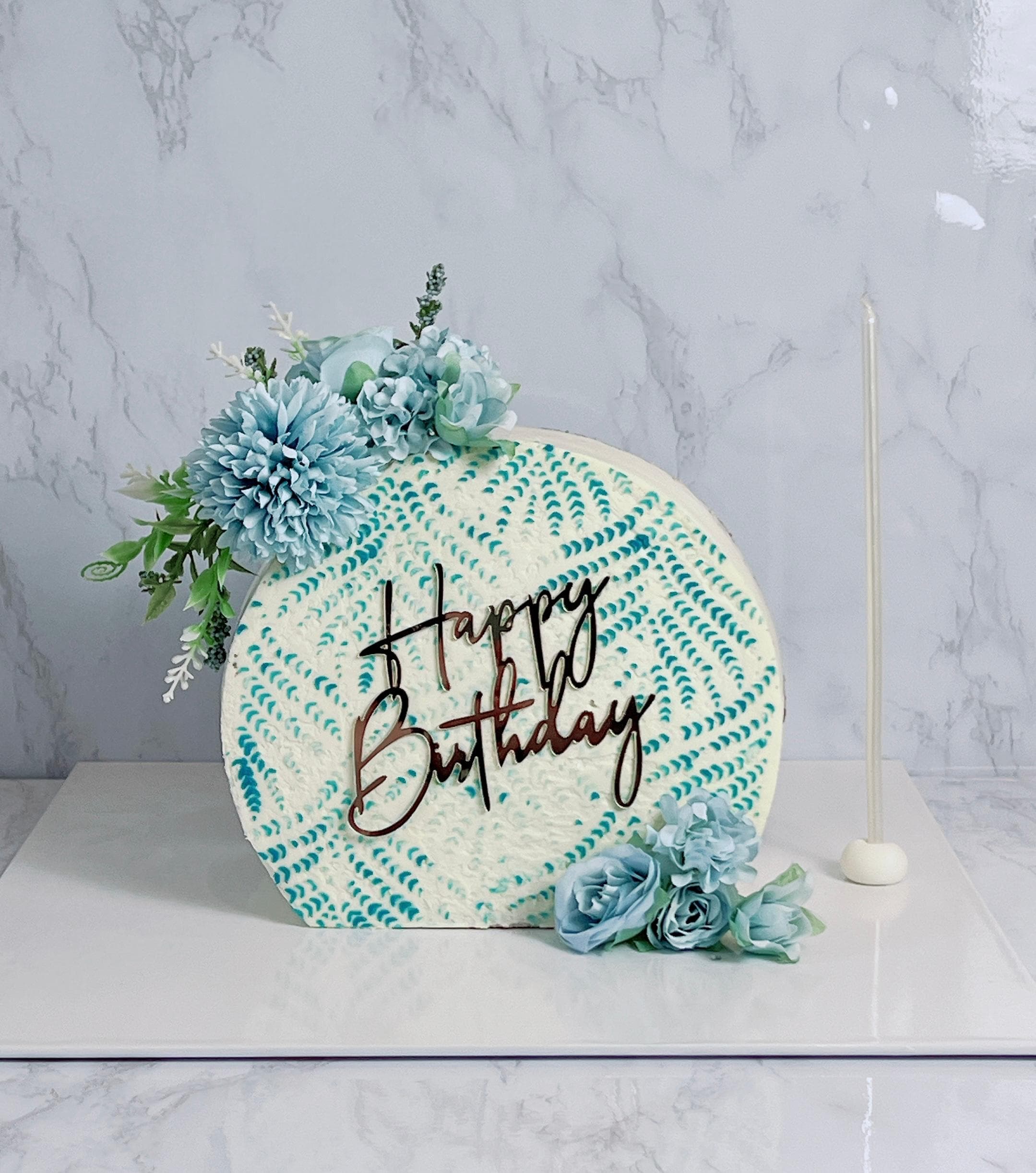Floral birthday cake with blue peony buttercream design