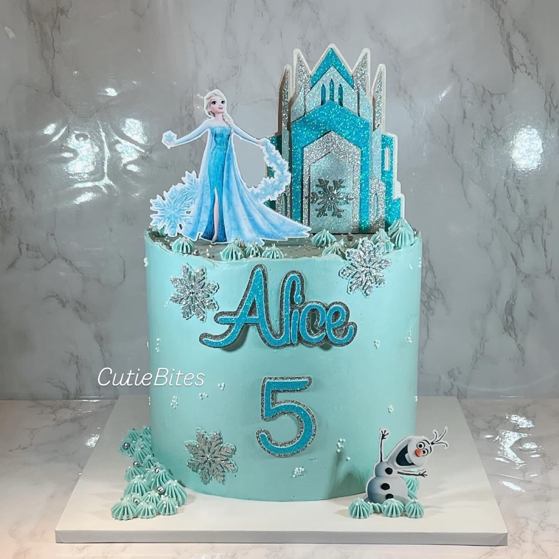 Frozen Elsa ice castle birthday cake with snowflakes and Olaf — Cutie Bites, Orpington