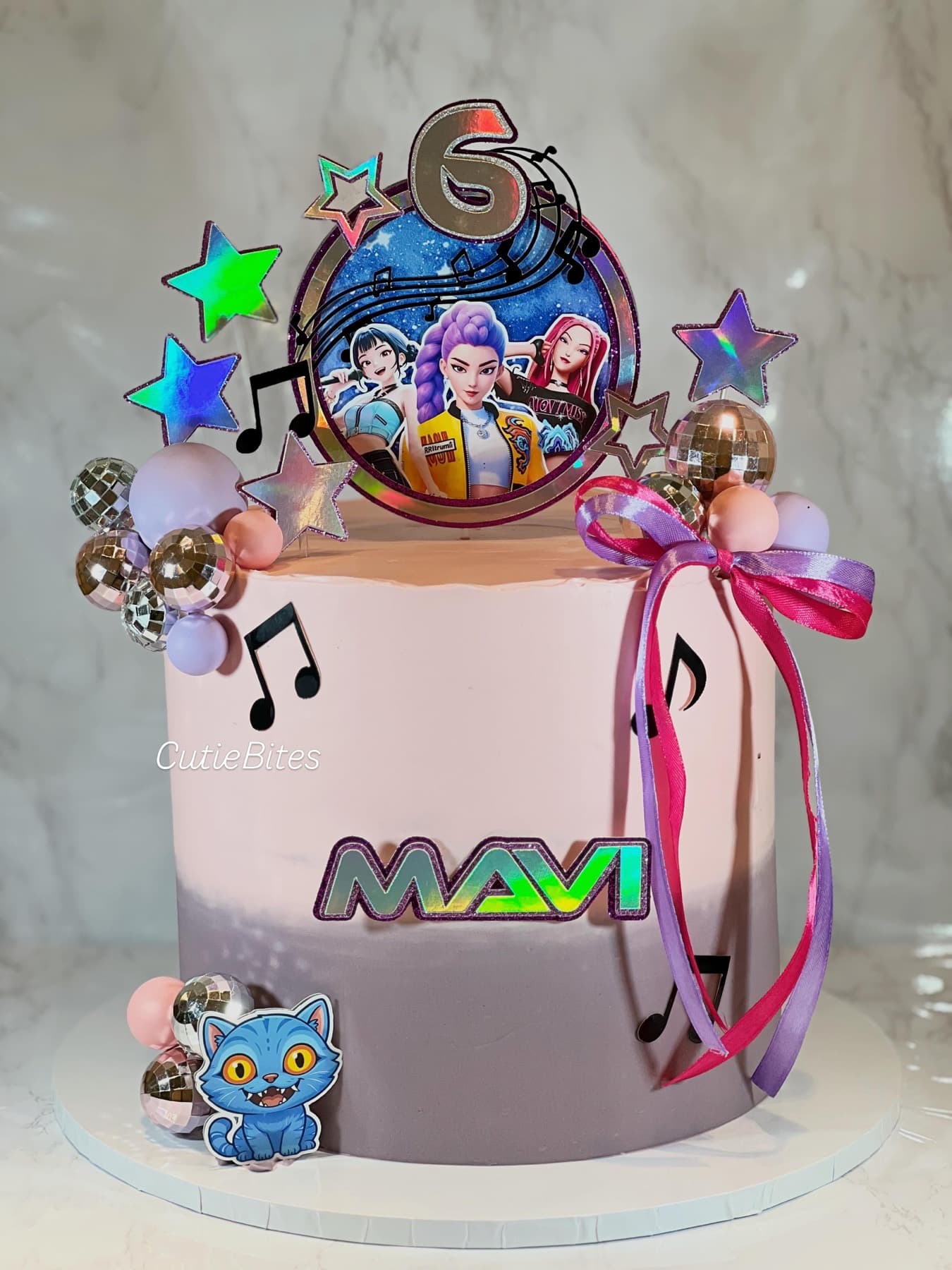 K-Pop Demon Hunters birthday cake with disco balls, stars and music notes — Cutie Bites, Orpington