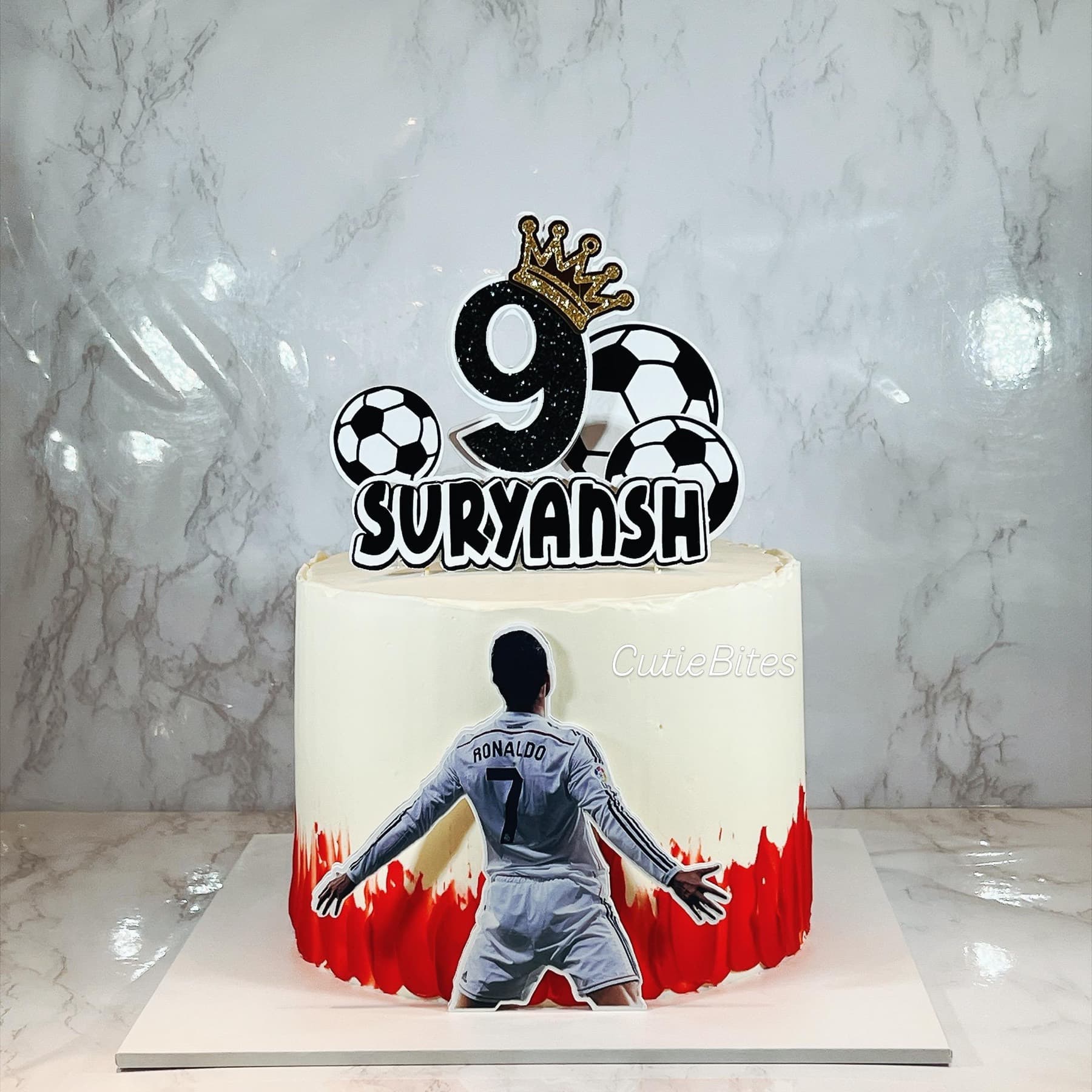 Ronaldo football birthday cake with red drip, footballs and crown topper — Cutie Bites, Orpington