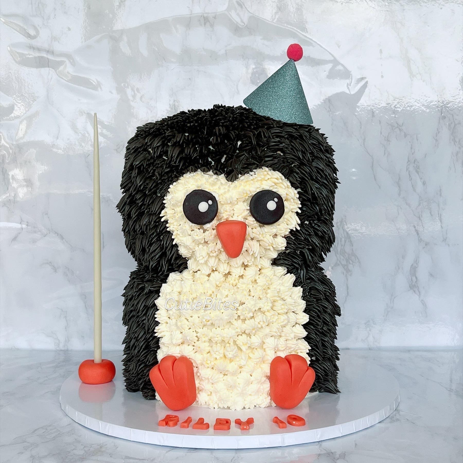 Sculpted penguin birthday cake with party hat and textured feathers — Cutie Bites, Orpington